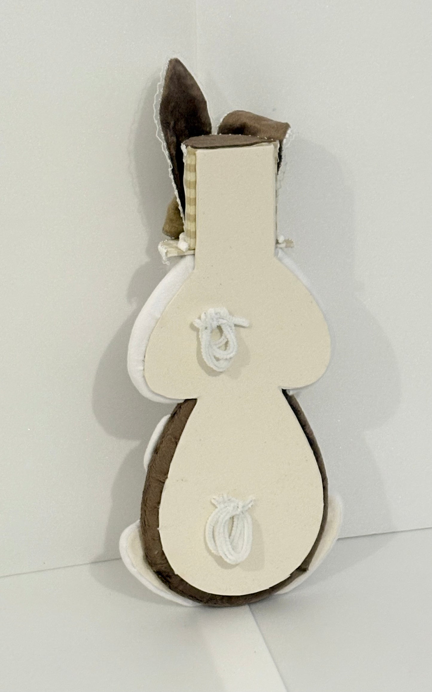 Light chocolate colour ell holding bunny attachment