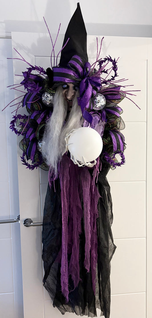 Halloween witch door decoration, lights up and has spooky sound effects in purples