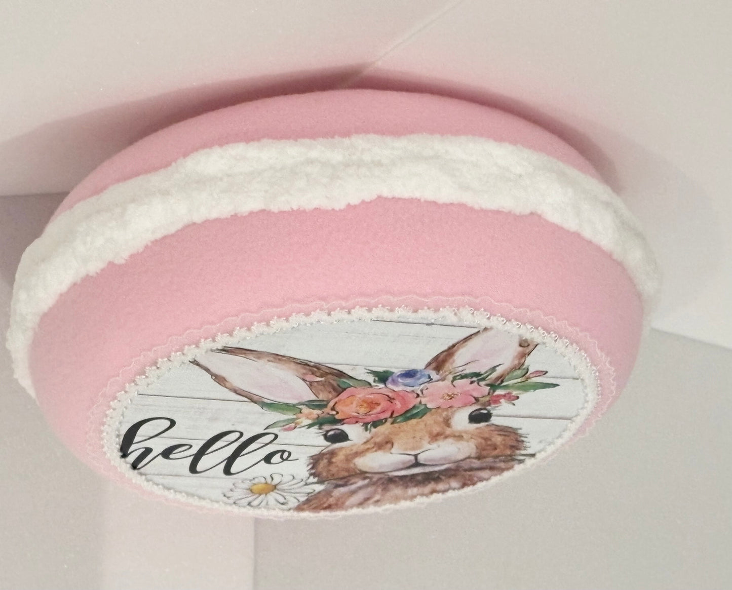 10.5” x 4” decorative macaron with bunny design saying “hello”