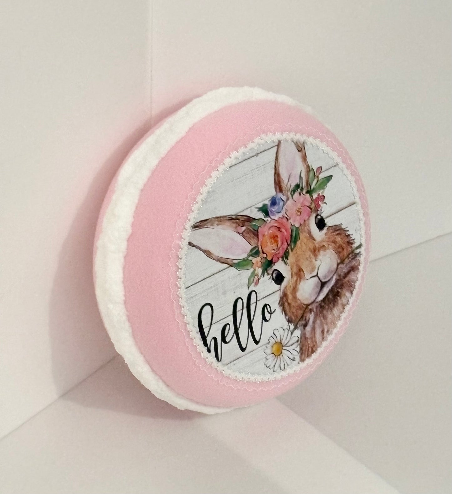 10.5” x 4” decorative macaron with bunny design saying “hello”
