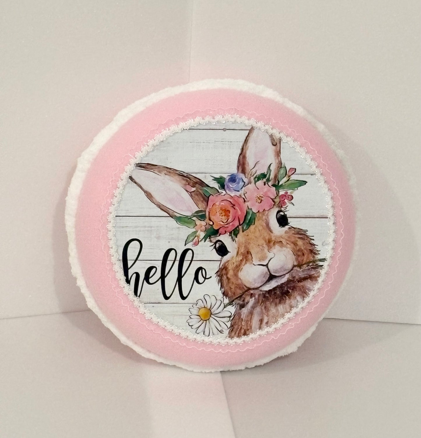 10.5” x 4” decorative macaron with bunny design saying “hello”