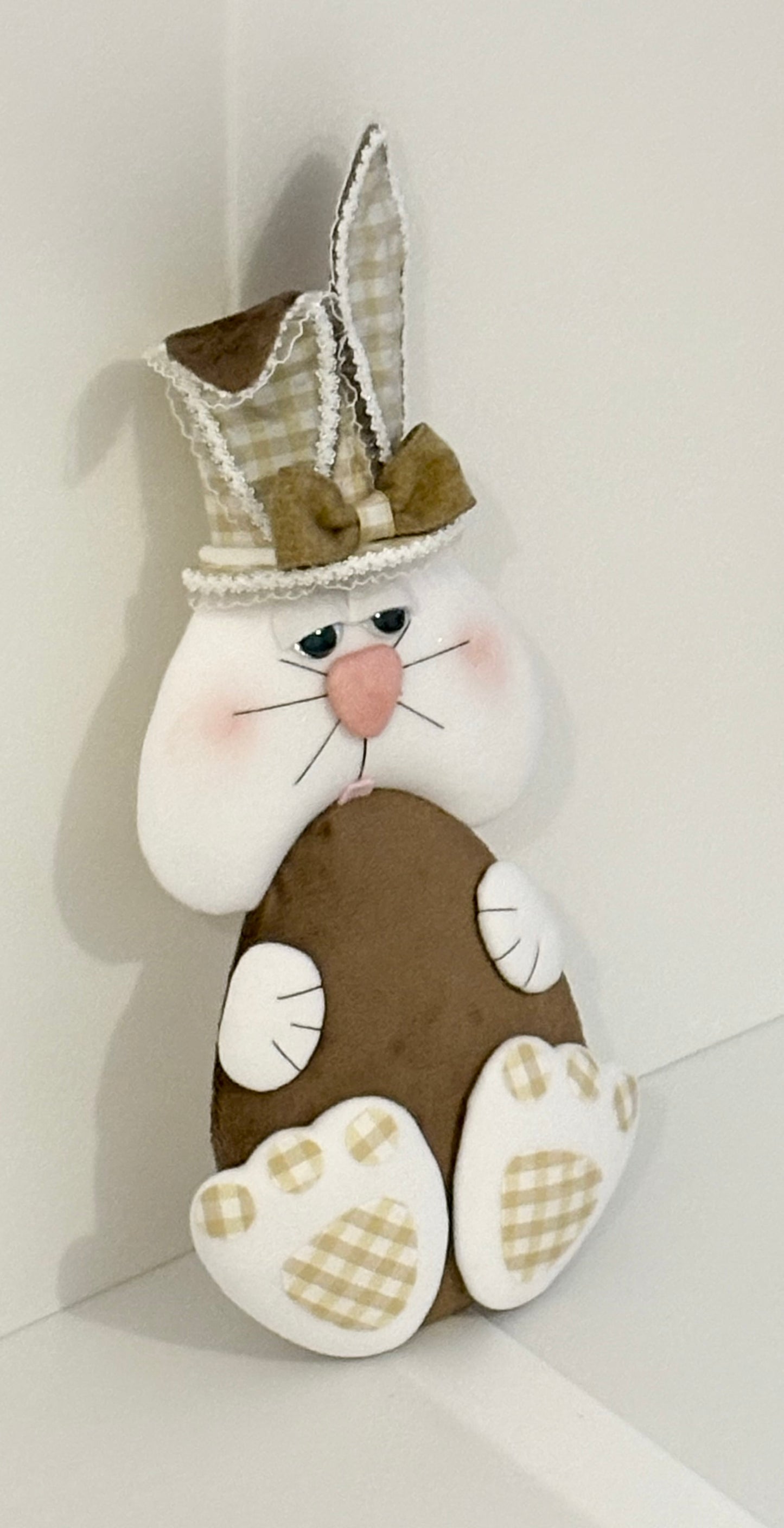 Light chocolate colour ell holding bunny attachment