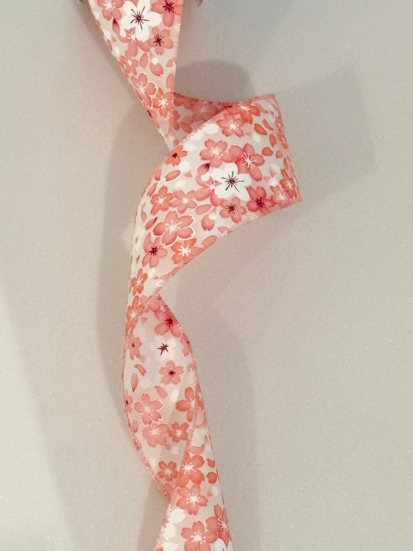 2.5” wired ribbon, peach and white flowers, sold by the meter