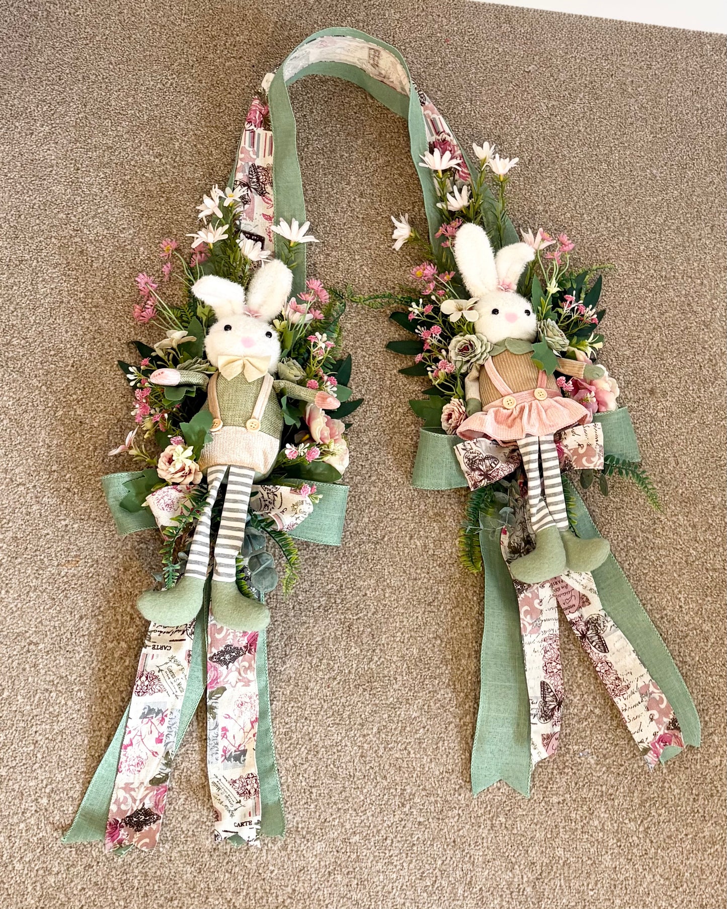 Another over the door Easter swag in beautiful greens and pinks with a boy bunny on one side and a girl on the other