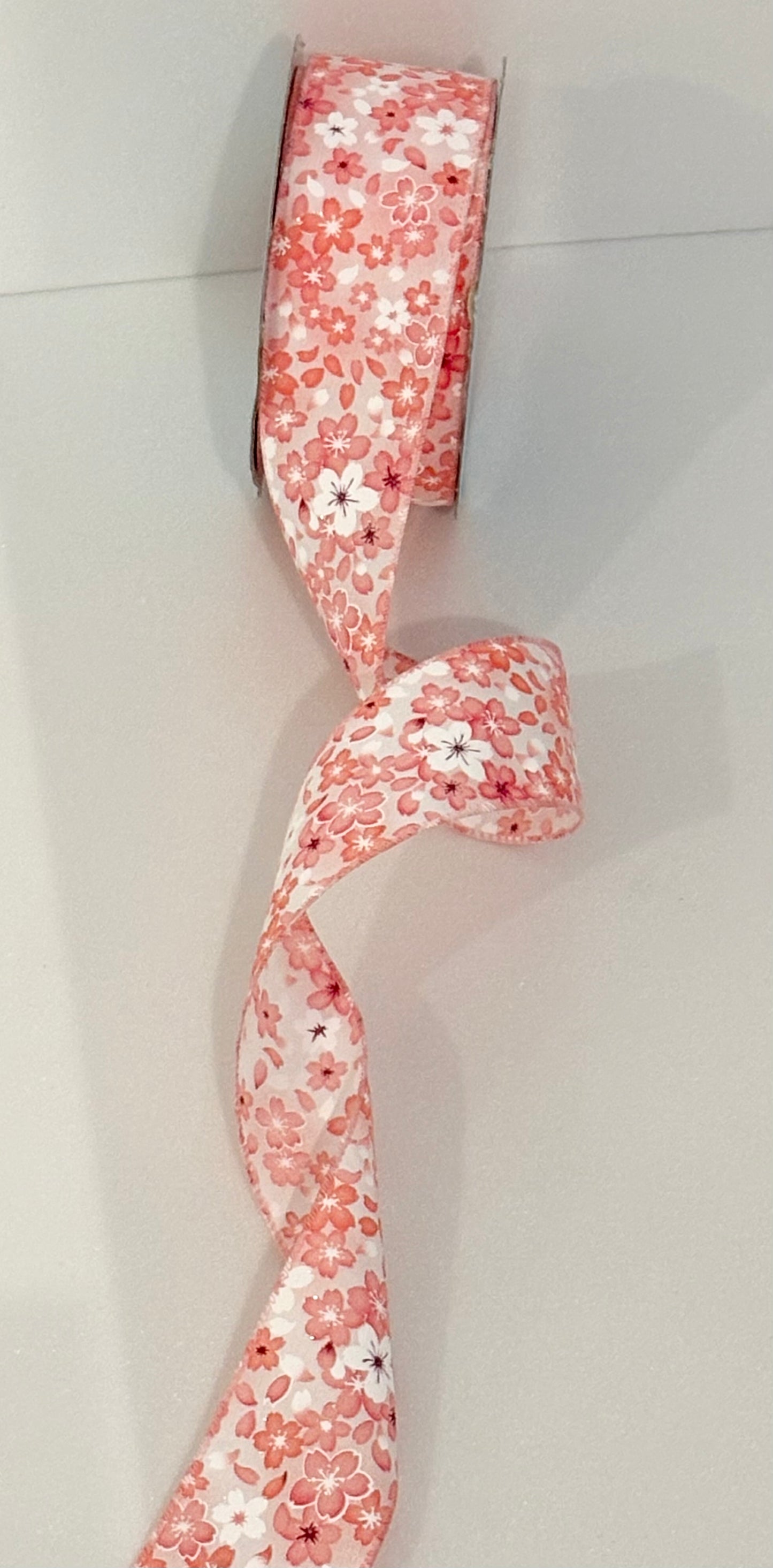 2.5” wired ribbon, peach and white flowers, sold by the meter